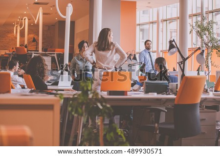 Start-up Team in modern coworking space Royalty-Free Stock Photo #489930571