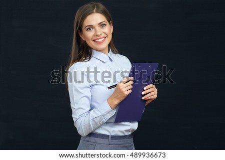 Social employee woman holding clipboard. Black background.