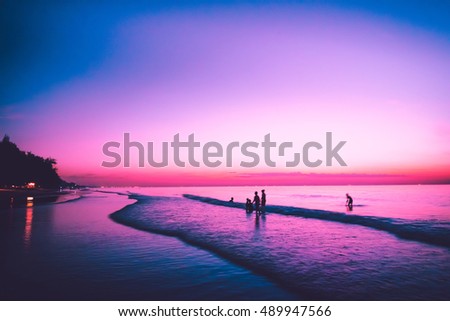 Nature background: Twilight sky after evening sunset and landscape seaside for family vacation concept - Vintage purple tone..