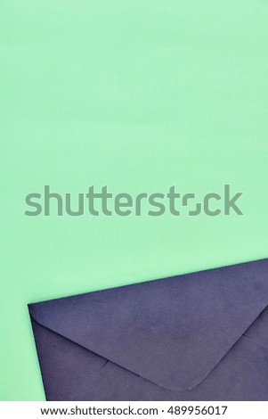 A studio photo of a black envelope