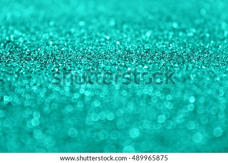 Abstract teal turquoise aqua and mint green color glitter sparkle background or fashion sequins celebration party invitation Royalty-Free Stock Photo #489965875