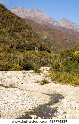 Autumn Yubiso river and Mount Tanigawa under blue sky