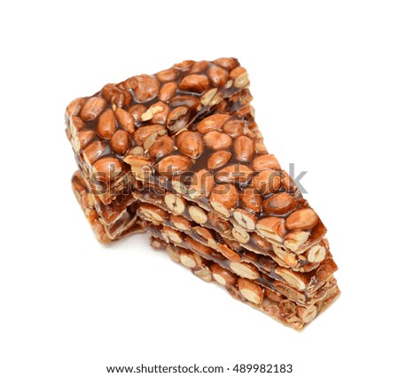 Peanut brittle candy isolated on white background