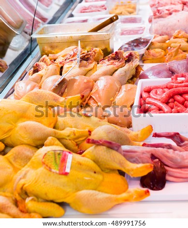 fresh chicken carcasses in a shop window