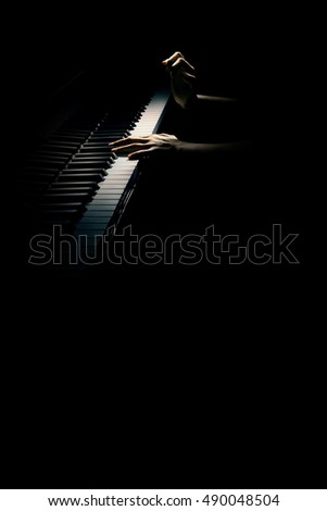 Piano hands pianist playing concert. Grand piano player close up. Musical instrument isolated on black