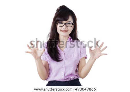 Young woman looking at the camera with expression frustrated, isolated on the white background