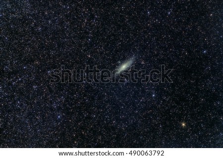 Astronomy space universe photo: the Andromeda galaxy (M31 or NGC224) with stars as a foreground. The total exposure 18 minutes. Can be used as a background or wallpaper 