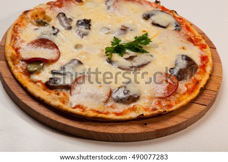pizza on a wooden cutting board