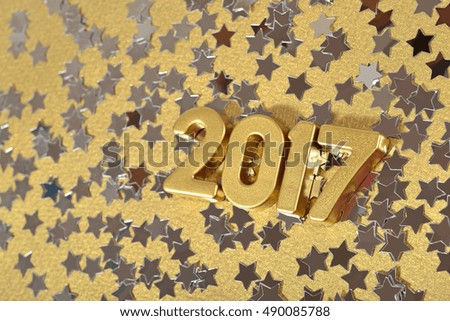 2017 year golden figures and silver stars on a gold background
