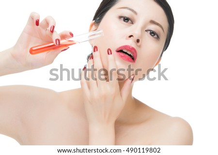 fashion woman cosmetic just like drinking toxic chemistry liquid, isolated on white background