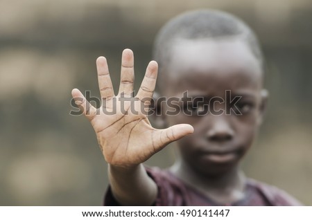 African Child Says STOP! To Racism and to War! Royalty-Free Stock Photo #490141447