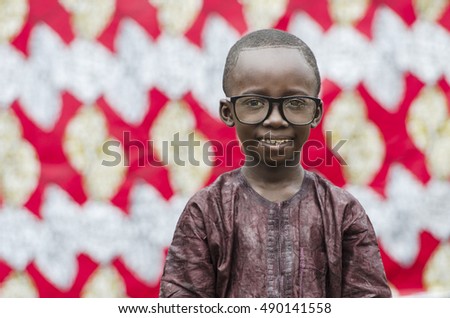 Black African Child Smiling with nerdy big glasses on!