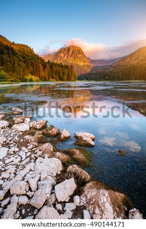 Great view of the azure pond Obersee glowing by sunlight. Popular tourist attraction. Picturesque and gorgeous scene. Location famous place Nafels, Mt. Brunnelistock, Swiss alps, Europe. Beauty world.