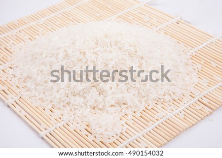 Rice on a bamboo roller shutter Royalty-Free Stock Photo #490154032