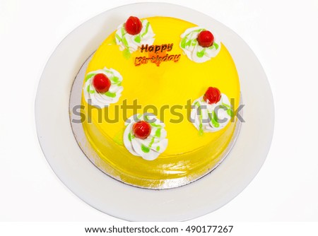 round shaped delicious  birthday cake with mango icing available with clipping path