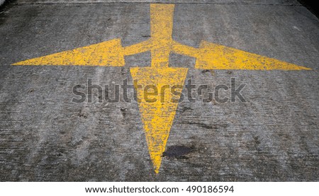 Yellow Arrow signs on the road.