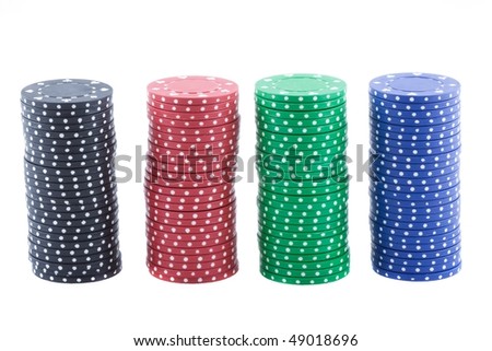Poker chips of four different colors isolated on over white background.
