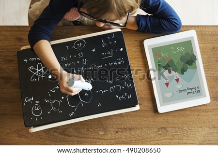Little Girl Writing Blackboard Concept