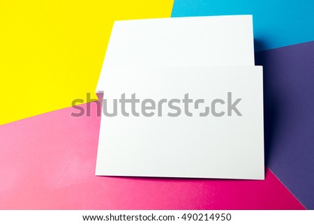 Business card blank over colorful abstract background.
