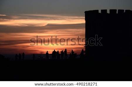 Barack tower  at La Perouse (Sydney, NSW, Australia). People resting at the tower and watching the sunset.  