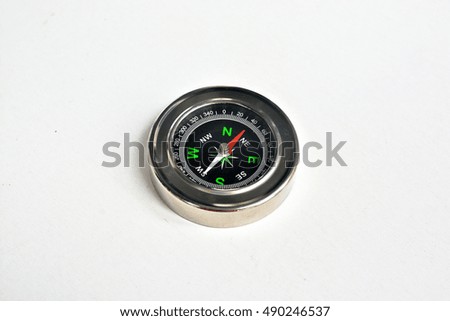 Compass on a white background. Magnetic navigation tool on a clean sheet of paper.