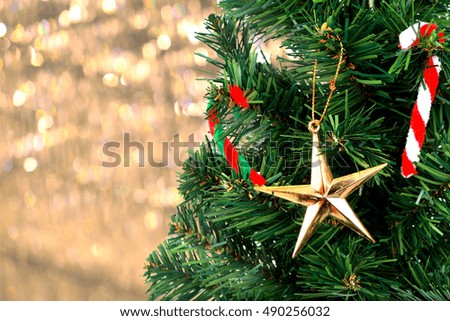 Gold Christmas background of de-focused lights with Christmas-tree 