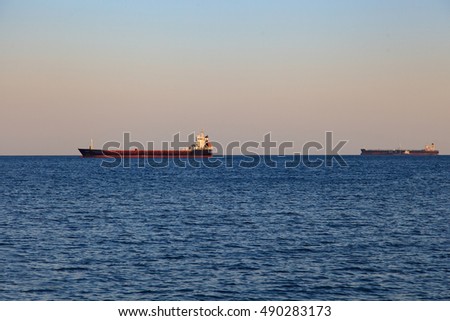 empty cargo ship in the sea Royalty-Free Stock Photo #490283173
