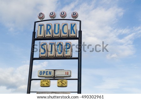  truck stop sign on highway roadside