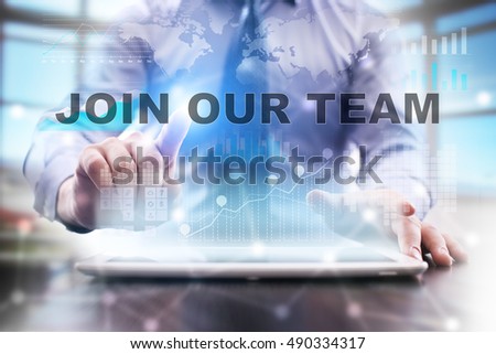 Businessman is using tablet computer, pressing button on touch screen and selecting "Join our team".