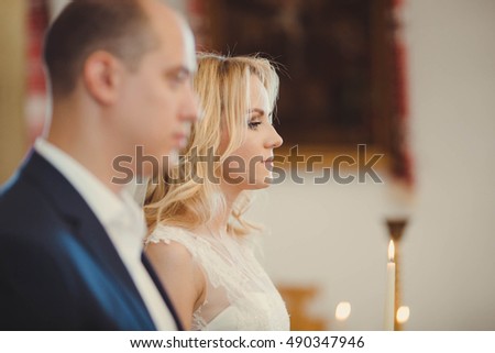 bride and groom at the wedding ceremony in church