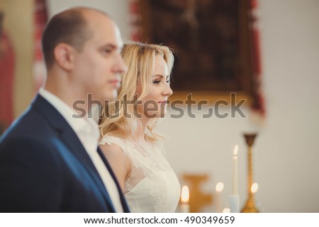 bride and groom at the wedding ceremony in church