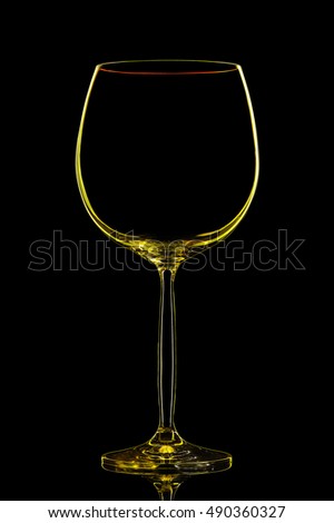 Silhouette of yellow wine glass with clipping path on black background.