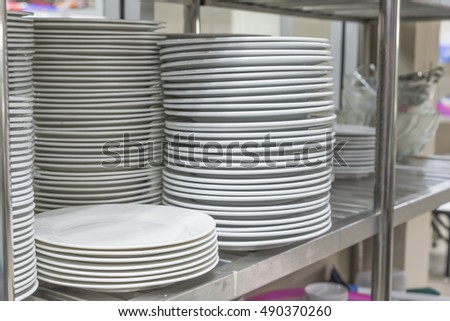 white ceramics plate and empty white bowl 