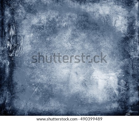 Beautiful abstract vintage grunge background with faded central area for your text or picture, scratched blue background