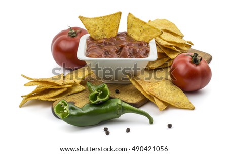 Tortilla chips with dip, green peppers and tomatoes isolated on white. Clipping path included in jpeg.