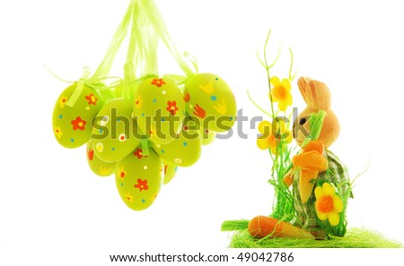 Easter eggs and bunny over white background