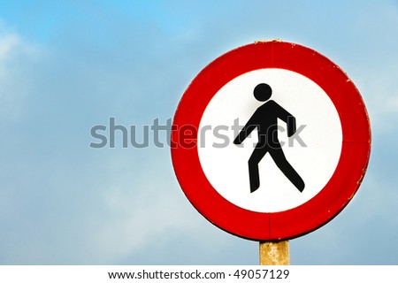 No pedestrian crossing sign on a blue sky
