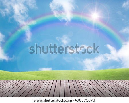 green field with rainbow and wooden  floor