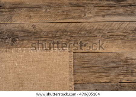 Texture of the old burlap and wood. Top view.