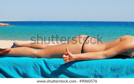 pretty woman relaxing on the beach