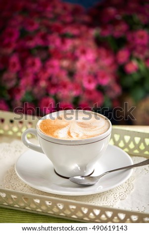 Bright picture of cup of capuccino coffee