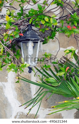 White lantern on the stone wall 