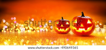 Halloween Pumpkin With Lights And Sparkle Bokeh Background
