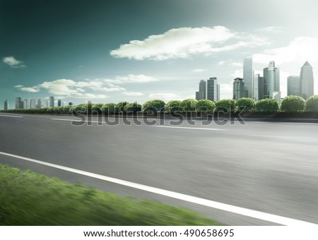 Motion blurred racetrack view on empty road asphalt 