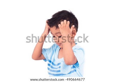 Cute child asian little boy scratching head 