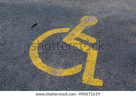 Handicapped disabled icon sign on  parking area in car park