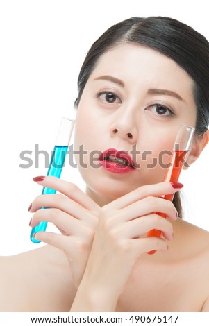 look through chemistry liquid tube just like cosmetic on face, isolated on white background, beauty portrait and science concept