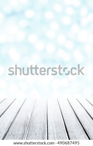 Empty wooden  table for product display with defocused blurry bokeh lights on background. Christmas and  New Year card