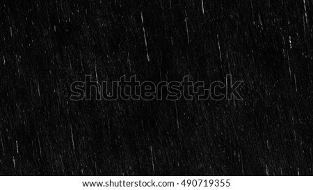 Falling raindrops footage animation in slow motion on black background, black and white luminance matte, rain animation with start and end, perfect for film, digital composition, projection mapping
