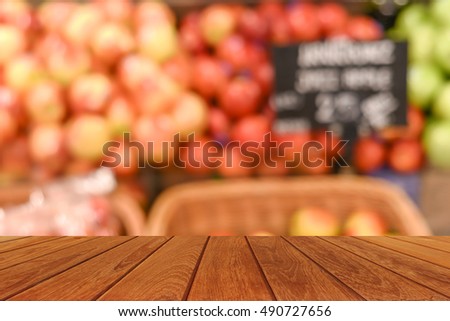 table top on blurred fruits in shopping mall super market - blur background